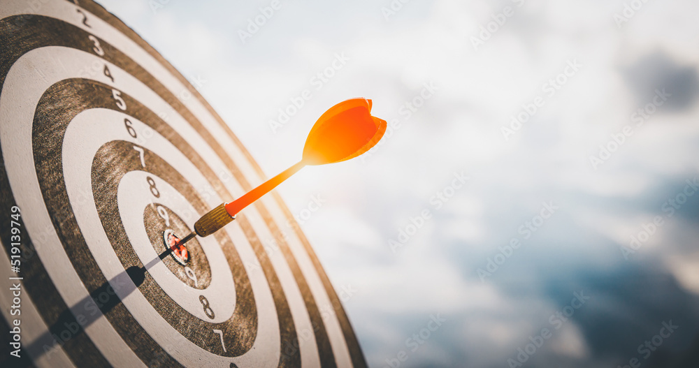 Close up shot red darts arrows in the target  of dartboard cente