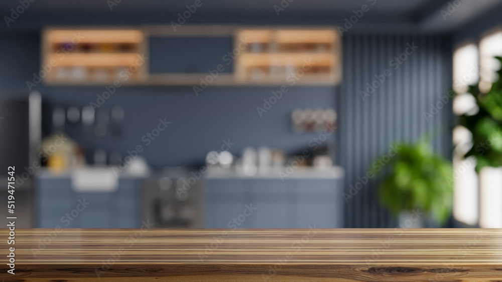 Wooden table top on blur kitchen room background,Modern kitchen room interior.