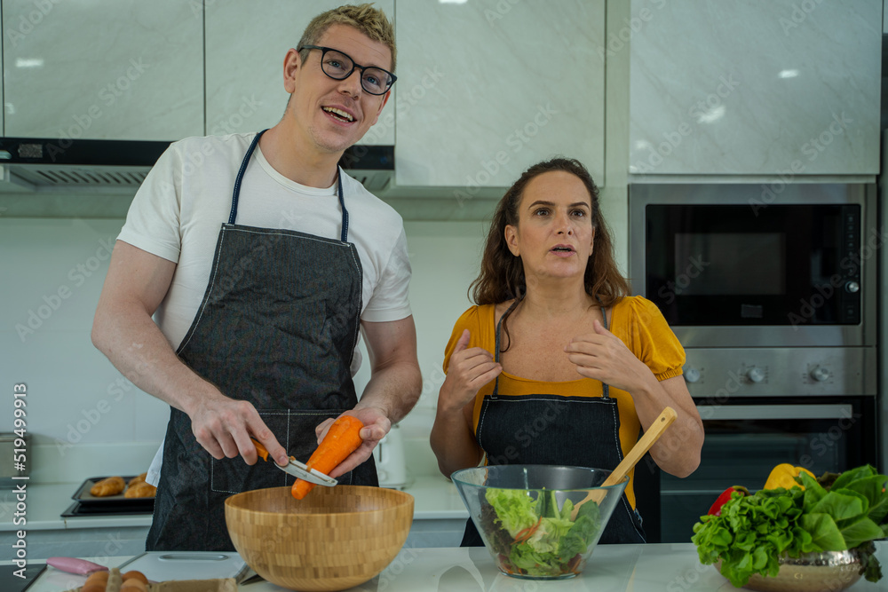 Family enjoy cooking salad together in kitchen room at home,Happy family happy holidays at home.