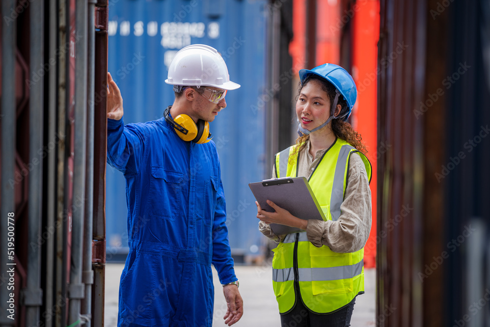 Businessman and Technicians or engineer work at Container cargo site check up goods in container.