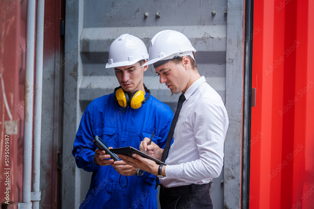 Foreman man and worker working checking at Container cargo,Logistics import export shipping concept.