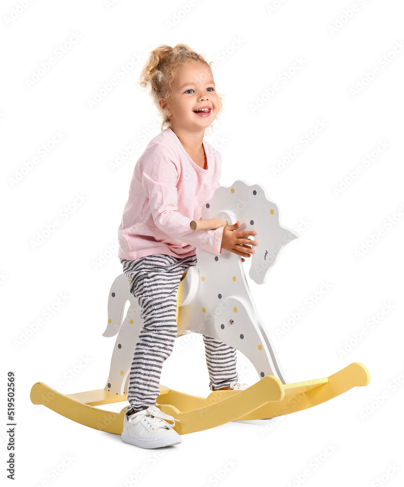 Adorable little girl with rocking horse on white background