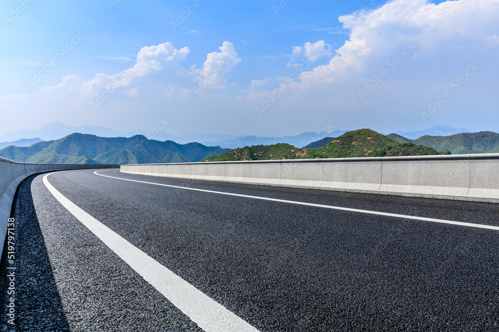 Asphalt highway and mountain with sky cloud scenery