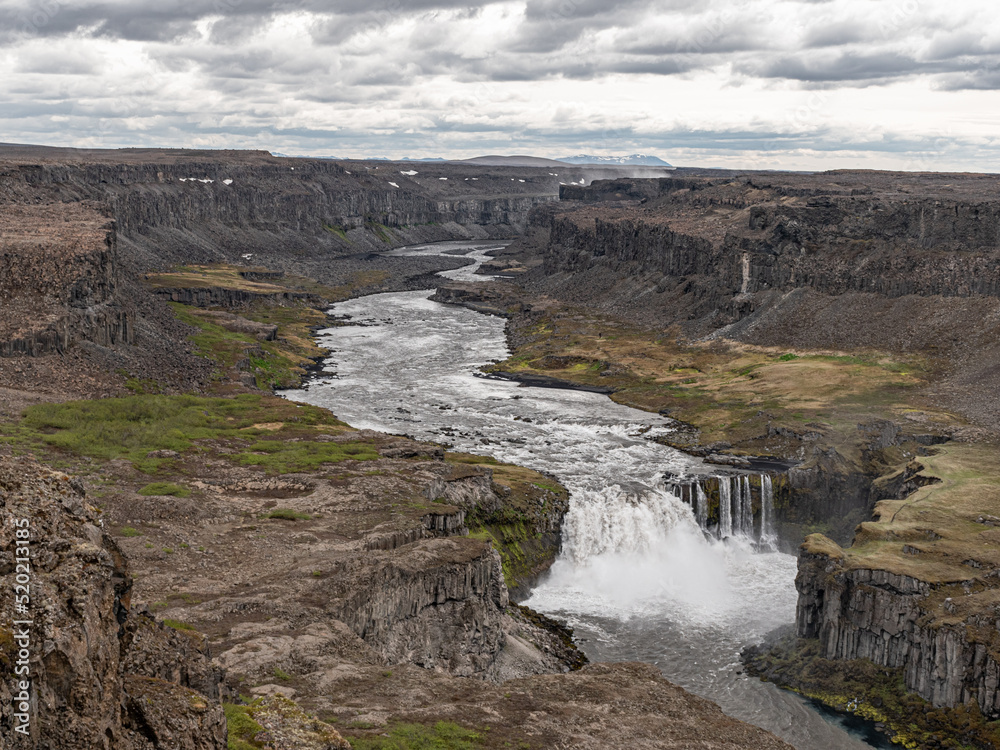 Aerial view of the waterfall Hafragilsfoss and the surrounding canyon Jokulsargljufur seen from the 