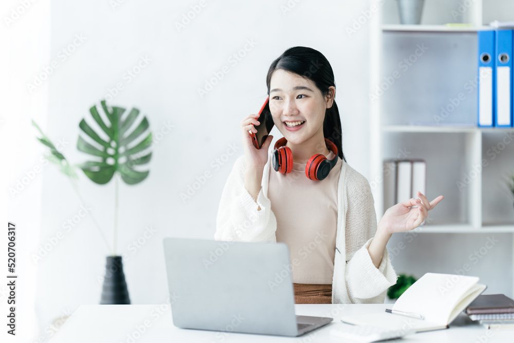 Asian woman video call online via the internet tutor on a computer laptop with headphone, Asian girl