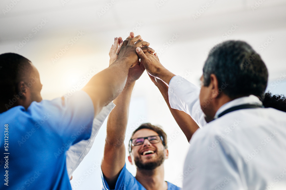 Happy doctors, medical professionals and team giving high five in celebration of success, wining and