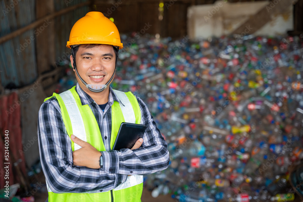 Portrait  of A recycling Analyst looking at plastic bottle ofr recycling waste To proceed to the nex