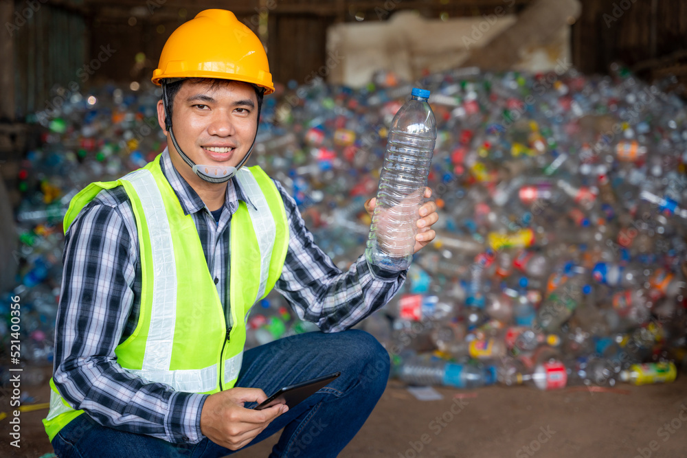 A recycling Analyst show at plastic bottle ofr recycling waste To proceed to the next process at rec