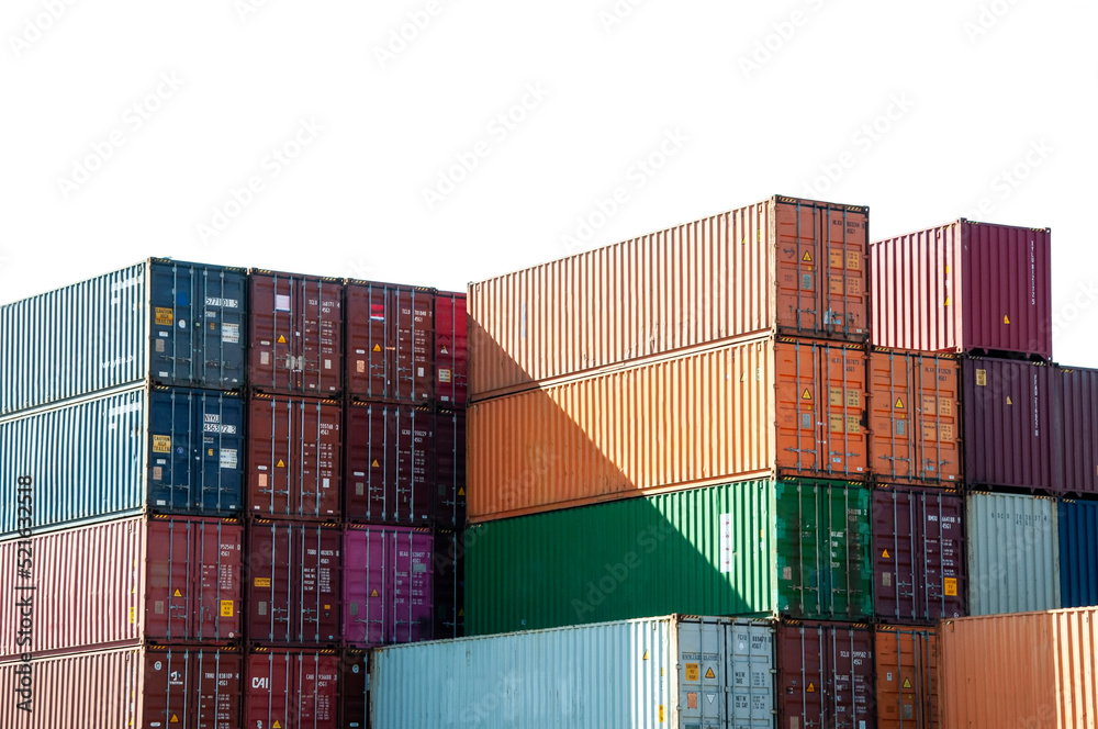 Shipping containers stacked against cut out white sky	