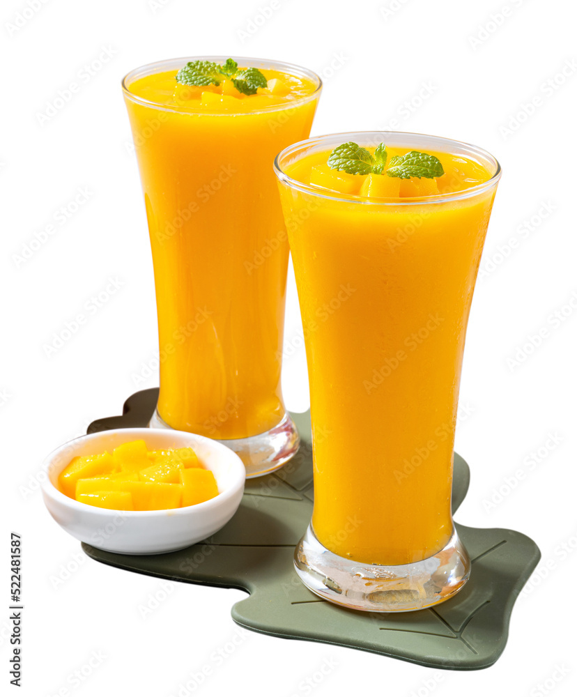 Fresh beautiful delicious mango juice smoothie in glass cup isolated on white background.