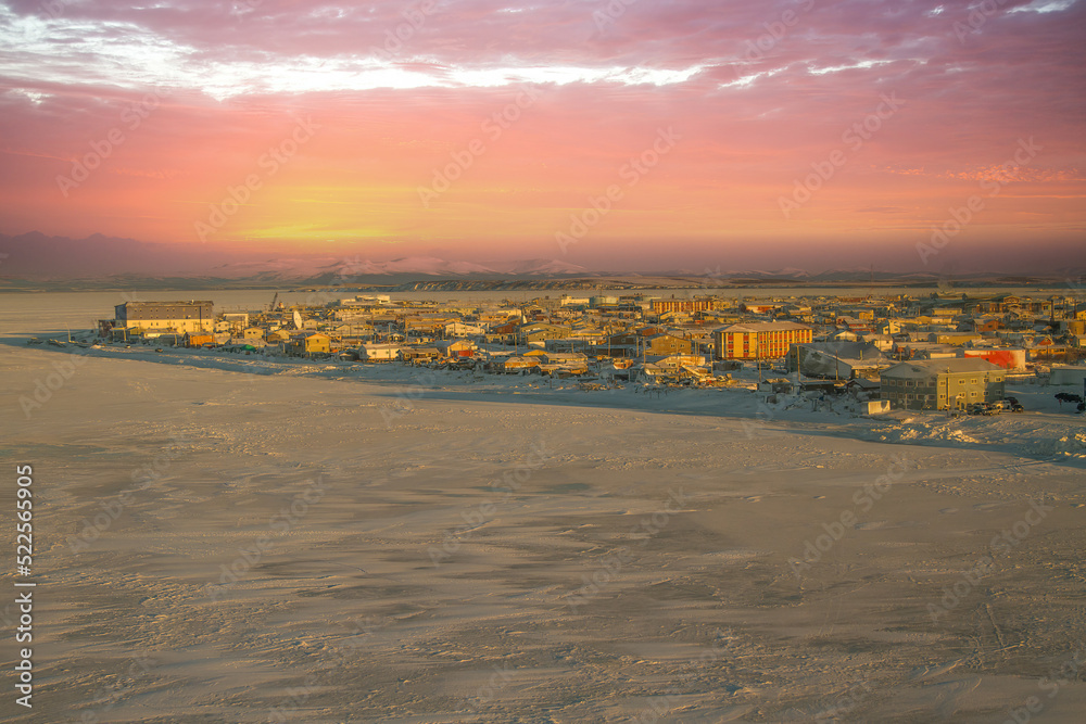 An aerial view on a cold winter morning at sunrise of the village of Kotzebue, Alaska