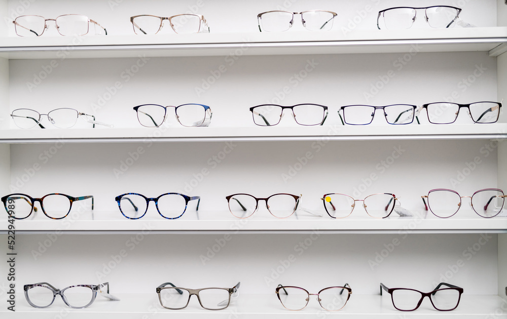 Eyeglasses shop. Stand with glasses in the store of optics.