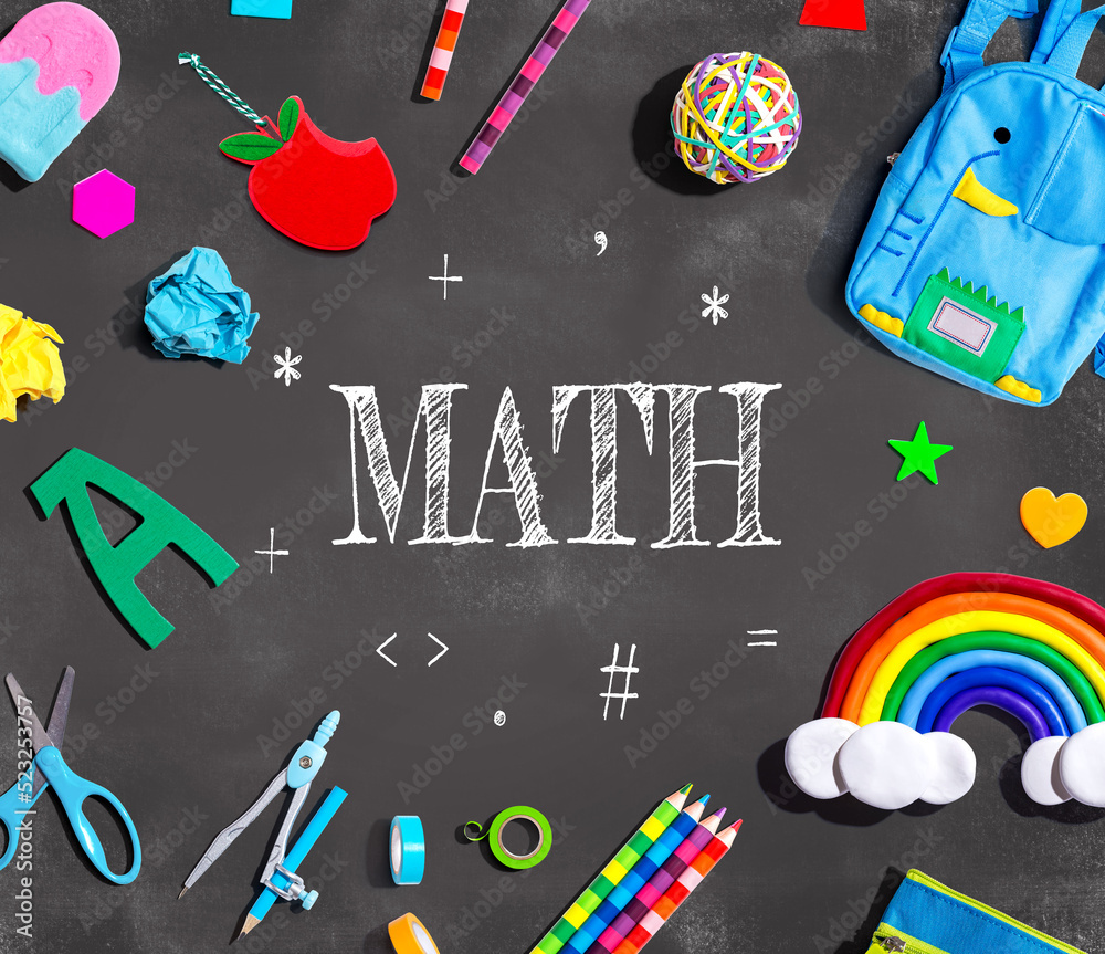 Math theme with school supplies on a chalkboard - flat lay