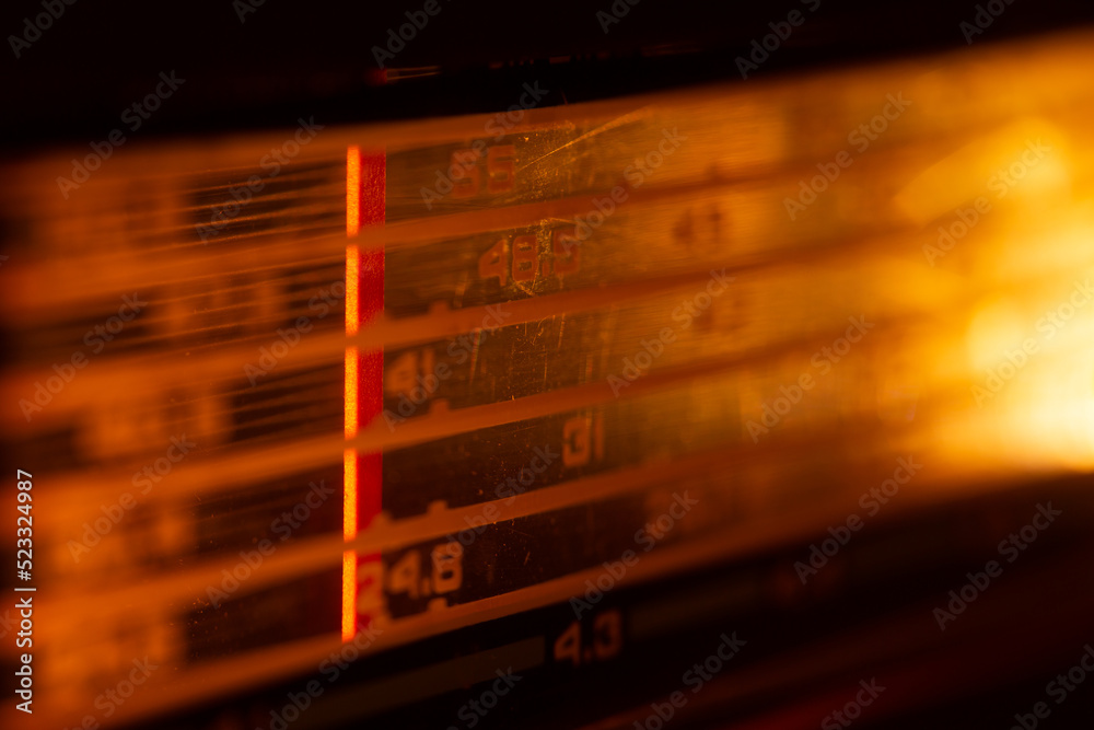 Vintage stereo - fm tuner radio scale close up. Listen to music concept