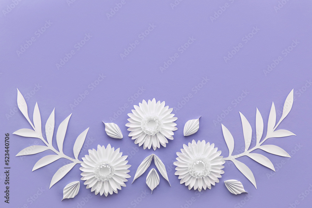 Composition with beautiful origami flowers and leaves on violet background