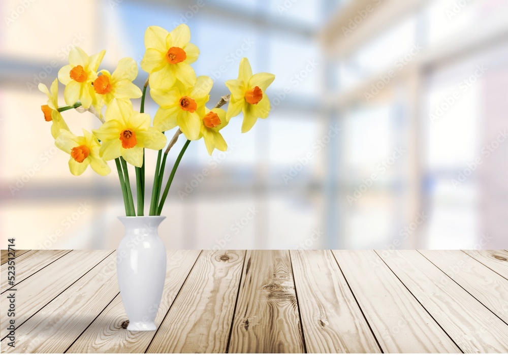 bouquet of fresh flowers on a wooden table. Neutral trendy colors interior decoration .