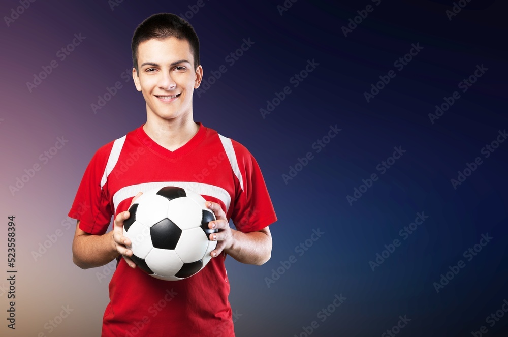 Young fun fan man cheer up support football sport team hold in hand soccer ball