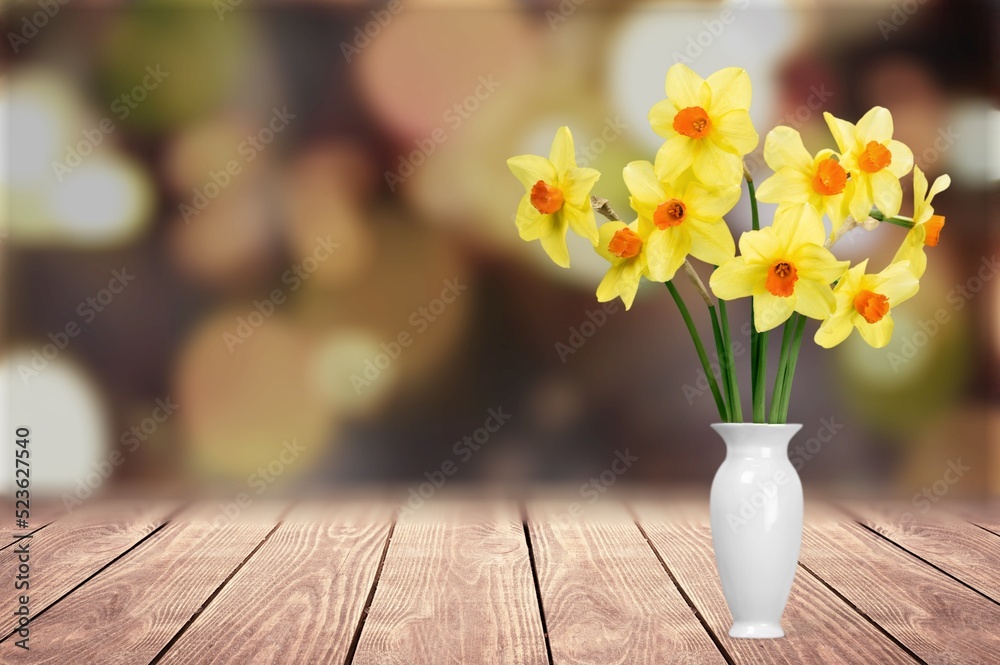 bouquet of fresh flowers on a wooden table. Neutral trendy colors interior decoration .