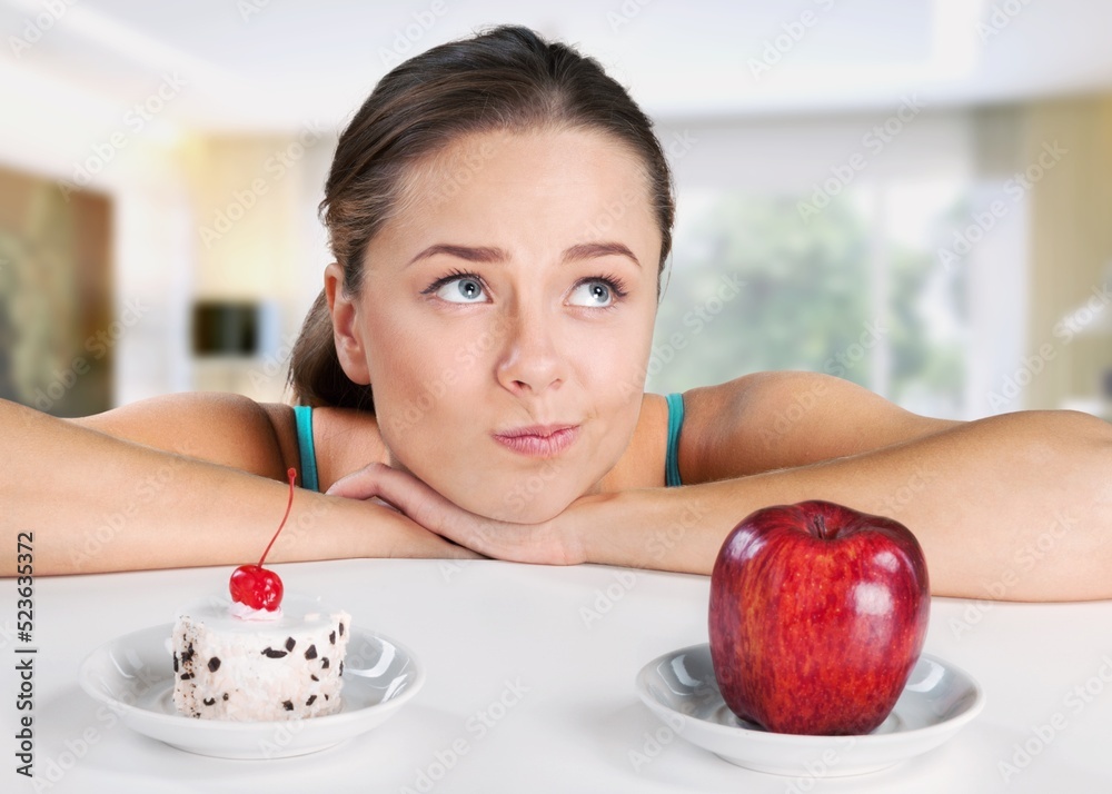 Young teenager girl refuses to eat cake. Say NO to unhealthy food, healthy eating and lose weight co