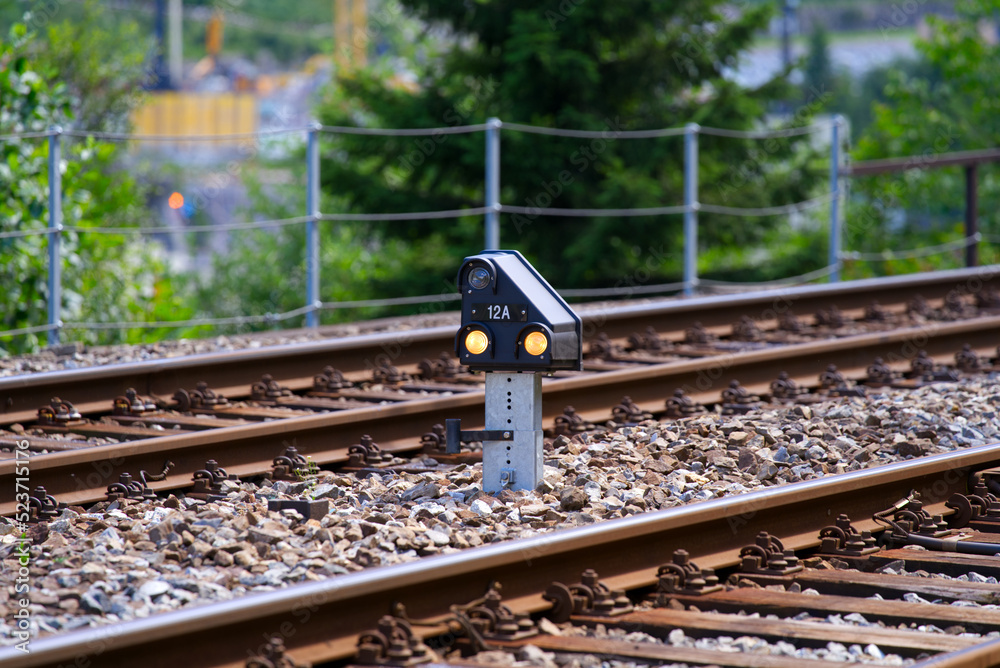 Ground railway signal neat railway station of mountain village Göschenen, Canton Uri, on a sunny sum