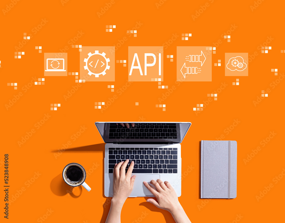 API - application programming interface concept with person using a laptop computer