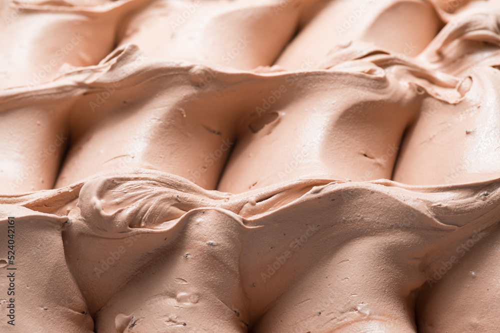 Frozen Coffee flavour gelato - full frame detail. Close up of a beige brown surface texture of Ice c