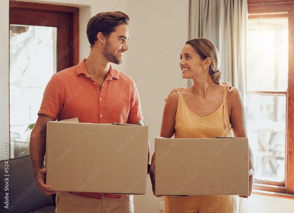 Moving, home and couple holding boxes while looking happy with their choice. Relationship, growth an