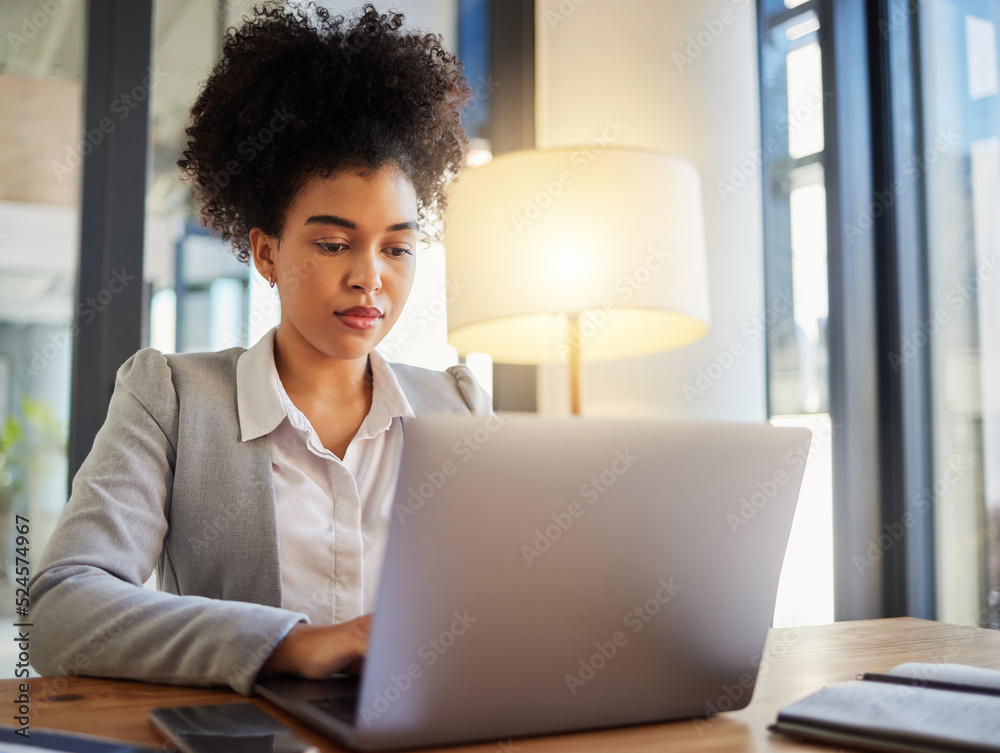 Laptop, typing and serious business woman reading emails at desk. Formal, professional and worker wi