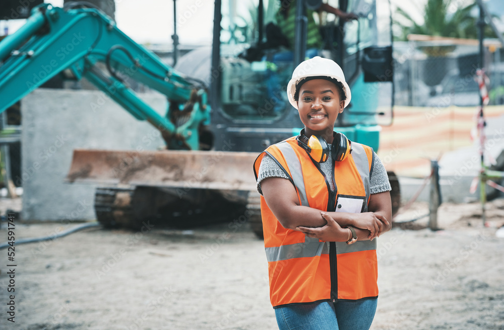 Happy woman construction worker with a ready to work smile on a job site outside. Portrait of a prou