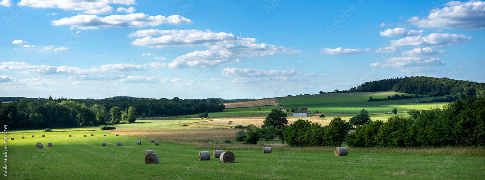 countryside landscape of belgian ardennes region near han sur lesse and rochefort with hay bales und