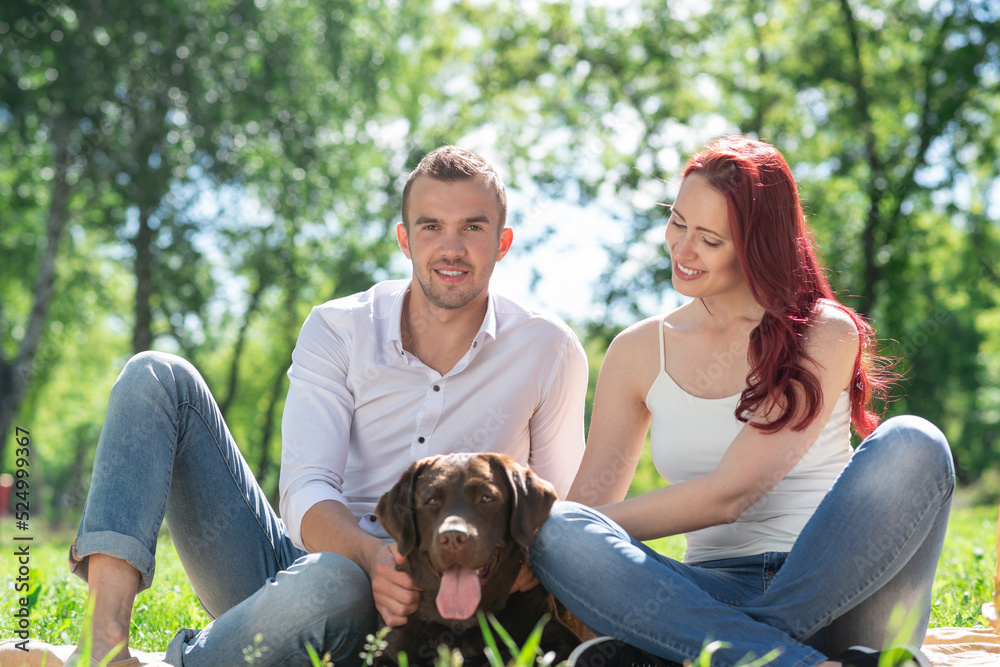 Couple with a dog in the park