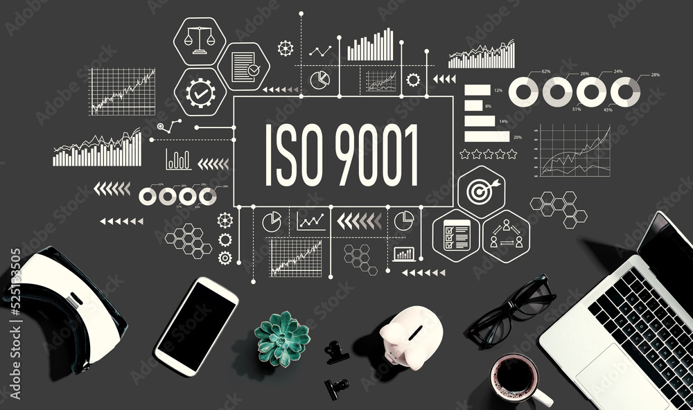 ISO 9001 theme with electronic gadgets and office supplies