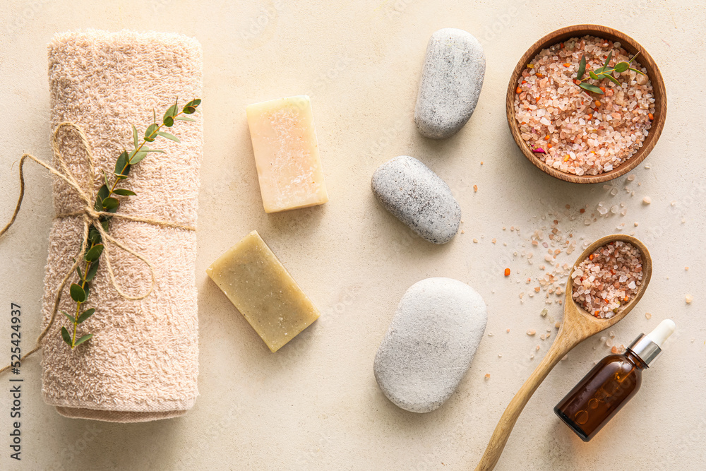 Spa composition with clean towel on light background