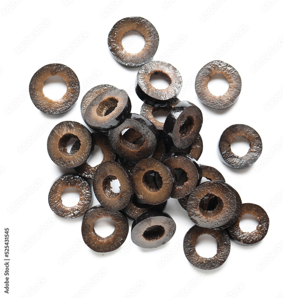 Heap of cut black olives on white background