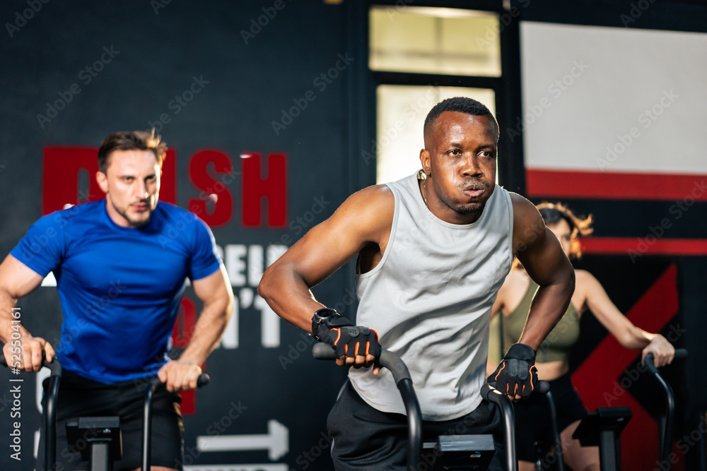 Group of young athlete people doing exercise together in fitness gym