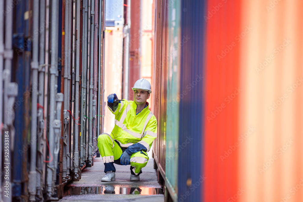 Container yard worker checking container at container yard warehouse,Logistics transportation and sh