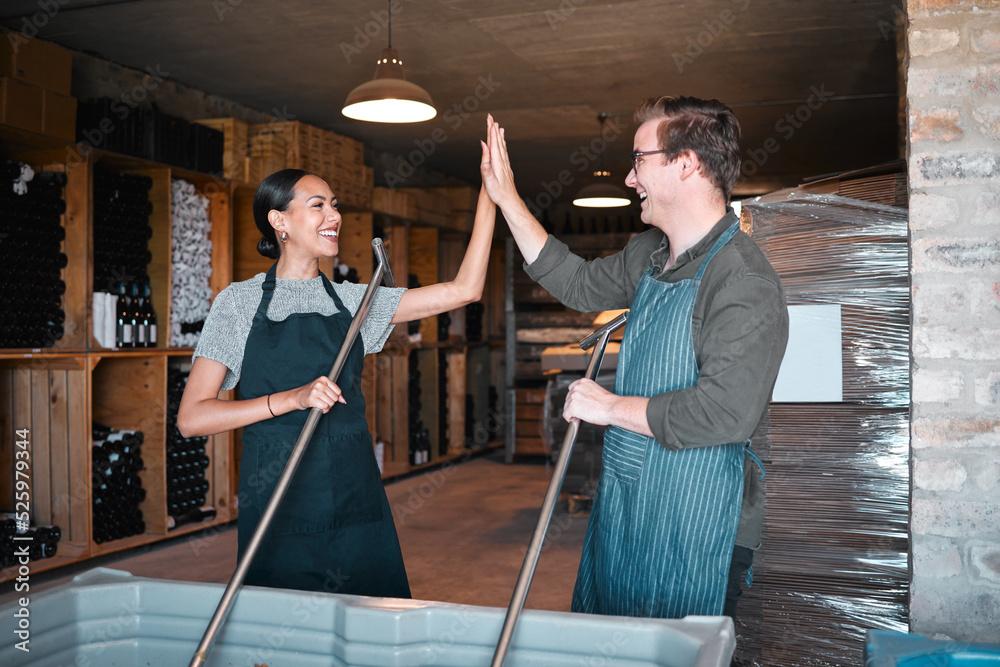 Teamwork high five, wine production success and grape crush at a winery, vineyard or restaurant. Sup