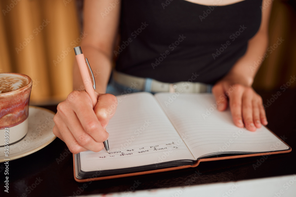 Learning woman writing in notebook, university student studying in library and education on paper in