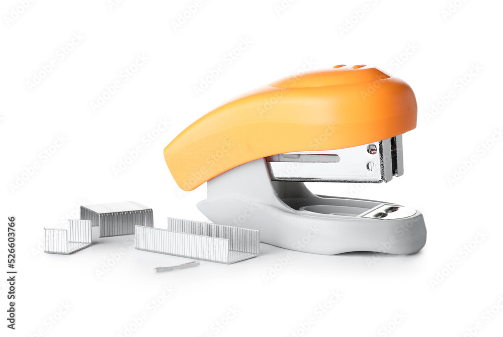 Orange stapler with staples on white background