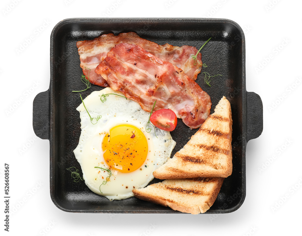 Frying pan with tasty fried egg, bacon and toasts on white background