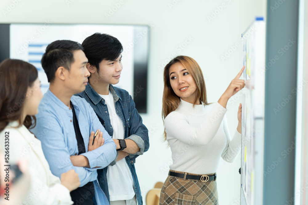 Group of businesspeople having meeting in conference room.