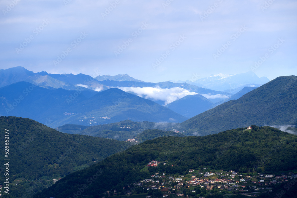 Aerial scenic view over region of Lugano, Canton Ticino, on a cloudy summer day. Photo taken July 4t