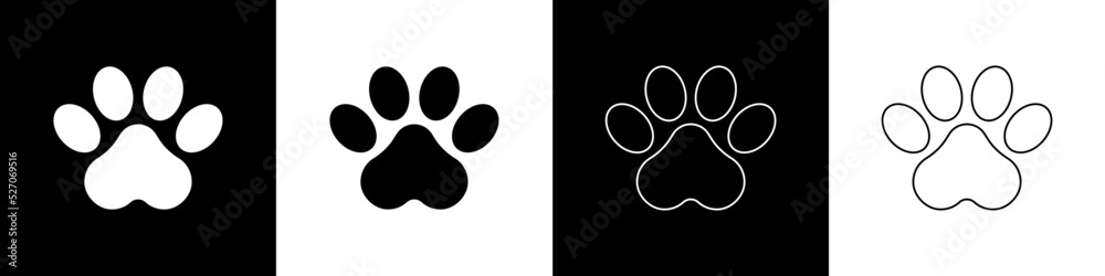 Set Paw print icon isolated on black and white background. Dog or cat paw print. Animal track. Vecto