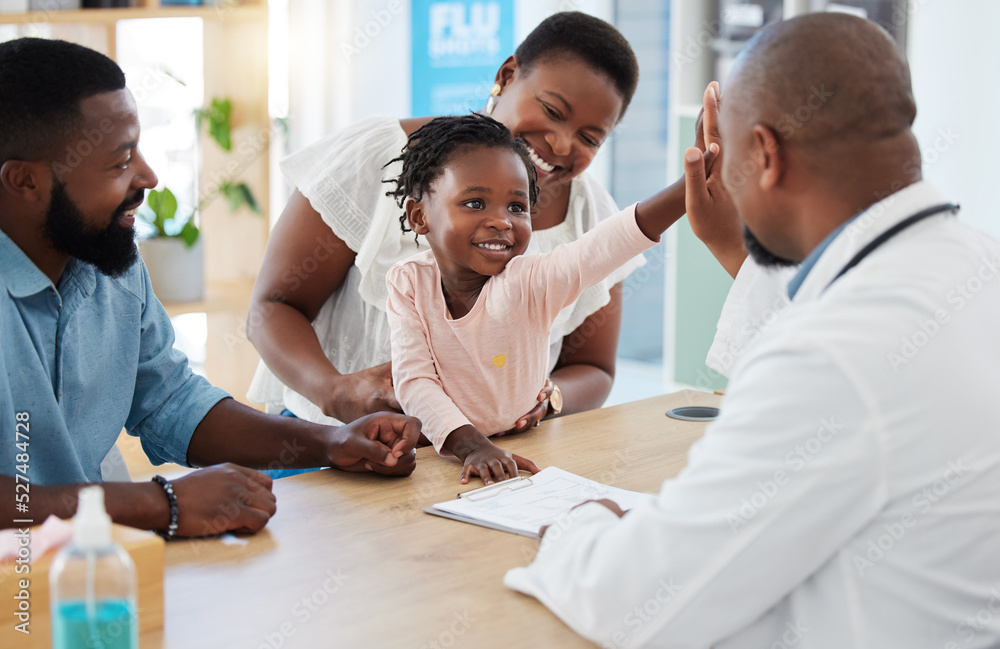 High five, doctor and family with a girl and her parents at the hospital for consulting, appointment