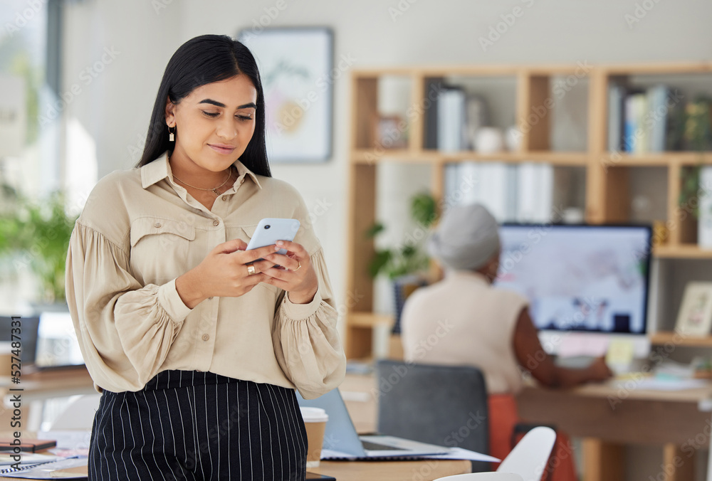 Phone, communication and networking with a business woman reading a message in her office at work. C