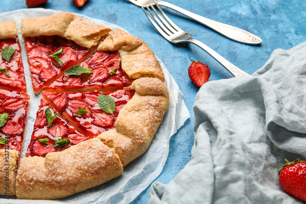 Delicious strawberry galette on color background, closeup