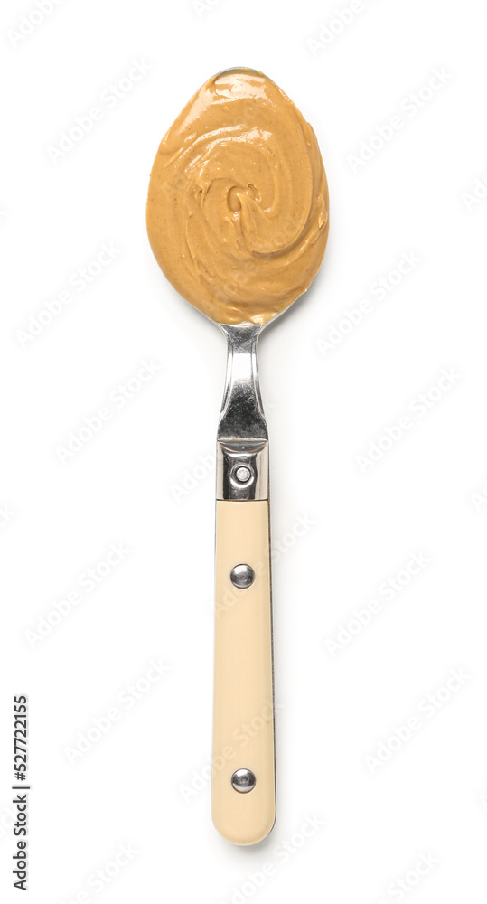 Spoon of tasty nut butter on white background