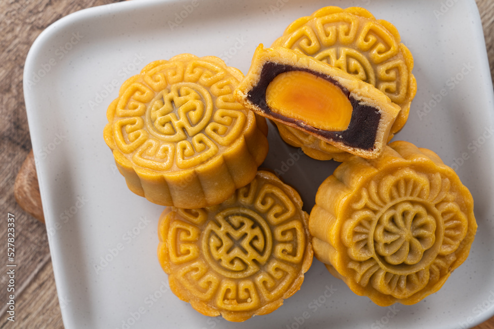 Delicious Cantonese moon cake for Mid-Autumn Festival food mooncake on wooden table background.