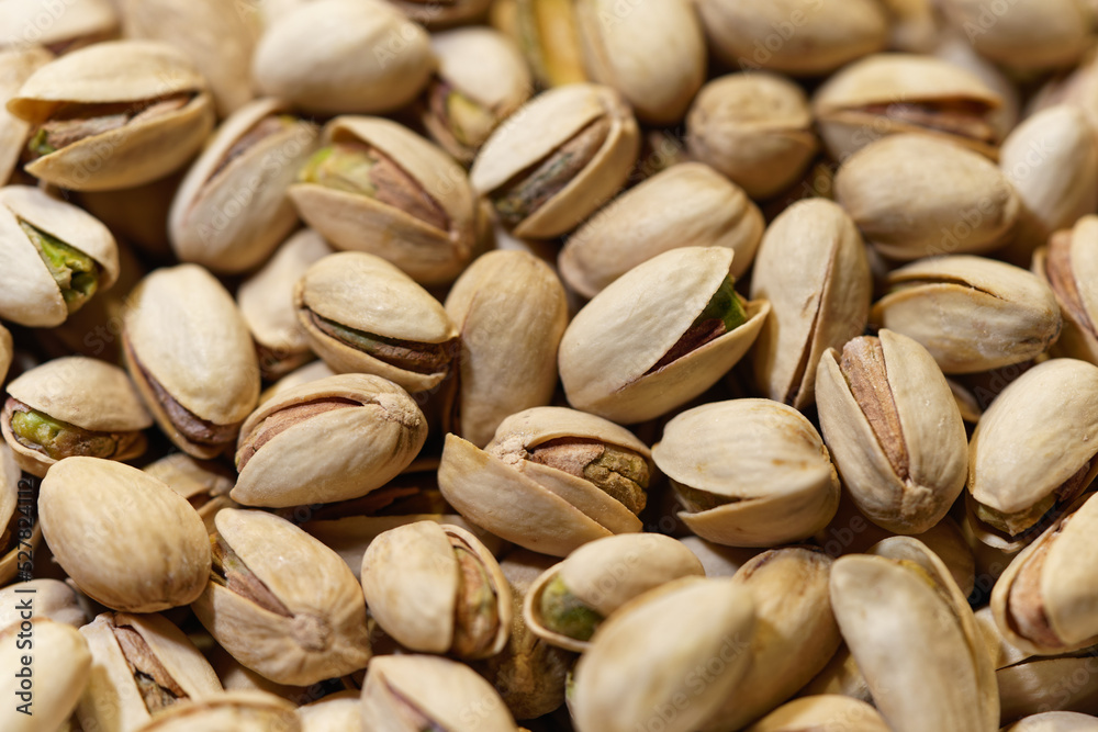 macro closeup shot of salted pistachios in shell