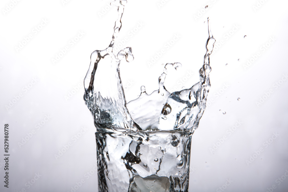 Close-up of water splashing in glass